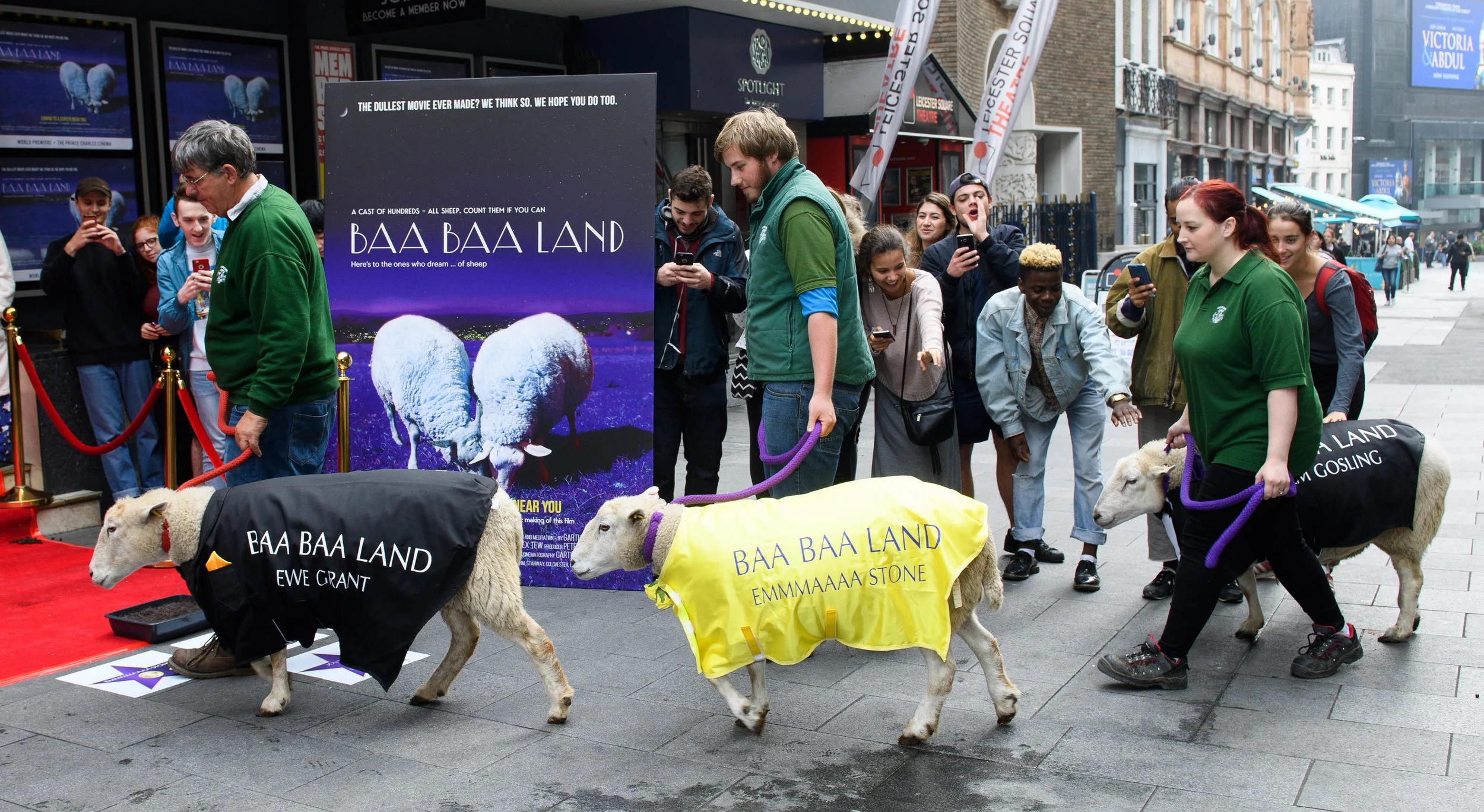 Costumed sheep walk outside the Prince Charles Cinema at the Baa Baa Land premiere