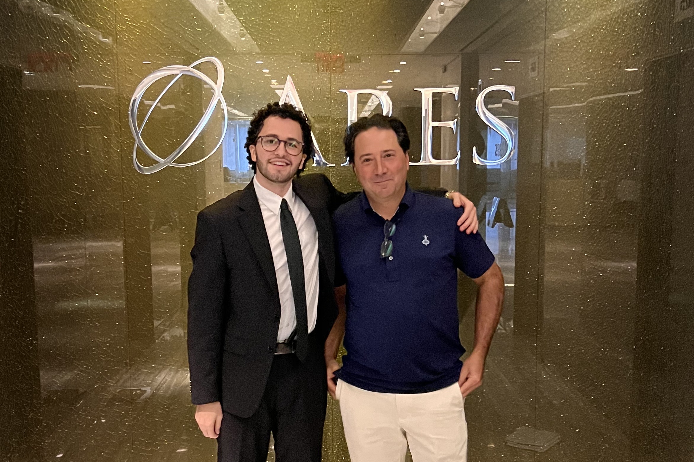 Posse Scholar Kamel Barghouti, left, standing with Michael Arougheti at Ares