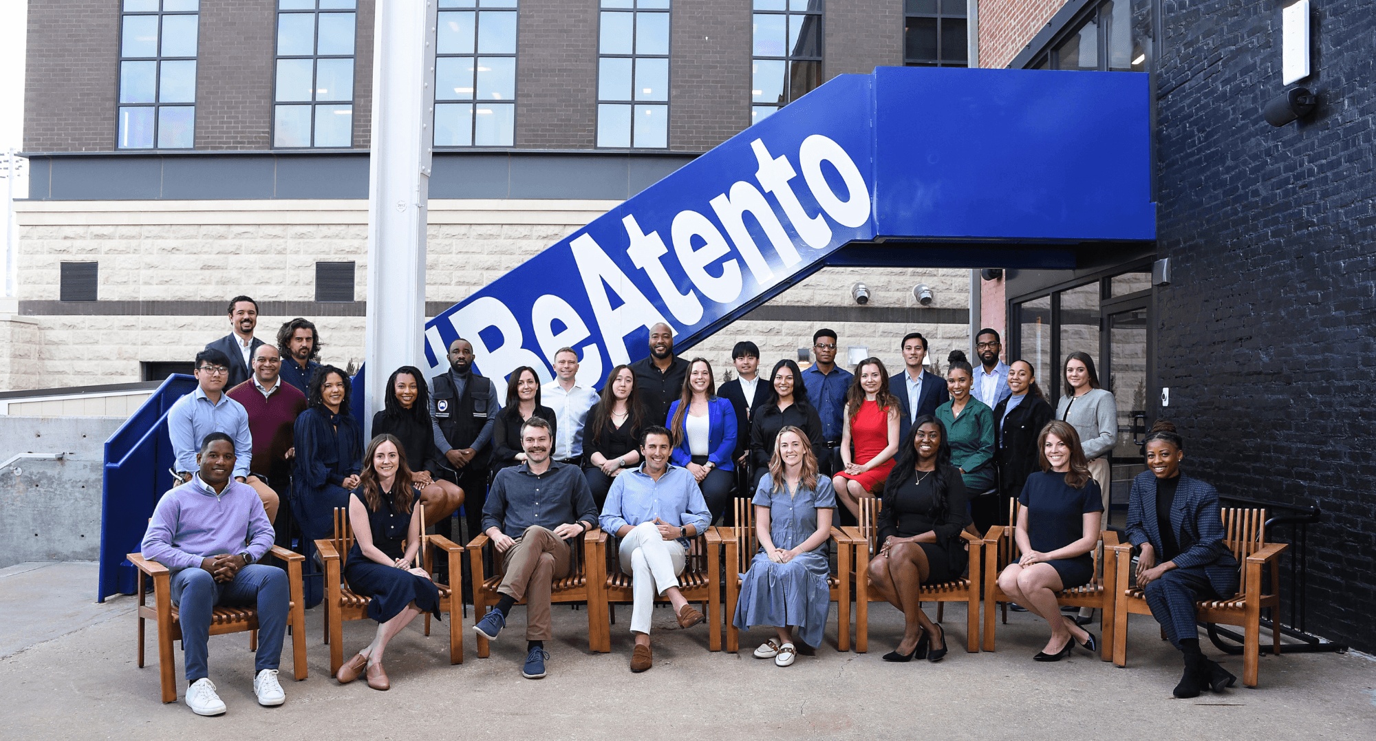 Michael Basch seated at the center of the Atento Capital team outside its Tulsa office