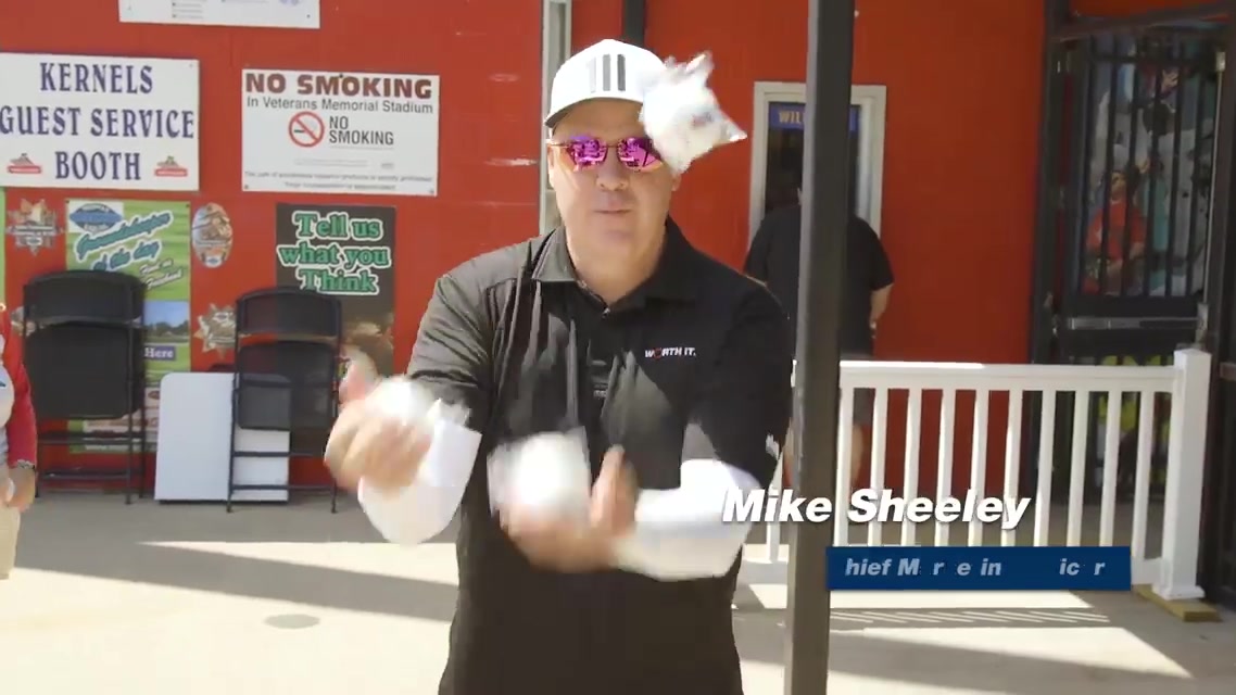Michael Sheeley tossing UFG baseballs at a Cedar Rapids Kernels promotion day
