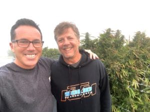 Will Bowden on the left and Michael DeMos standing together outdoors