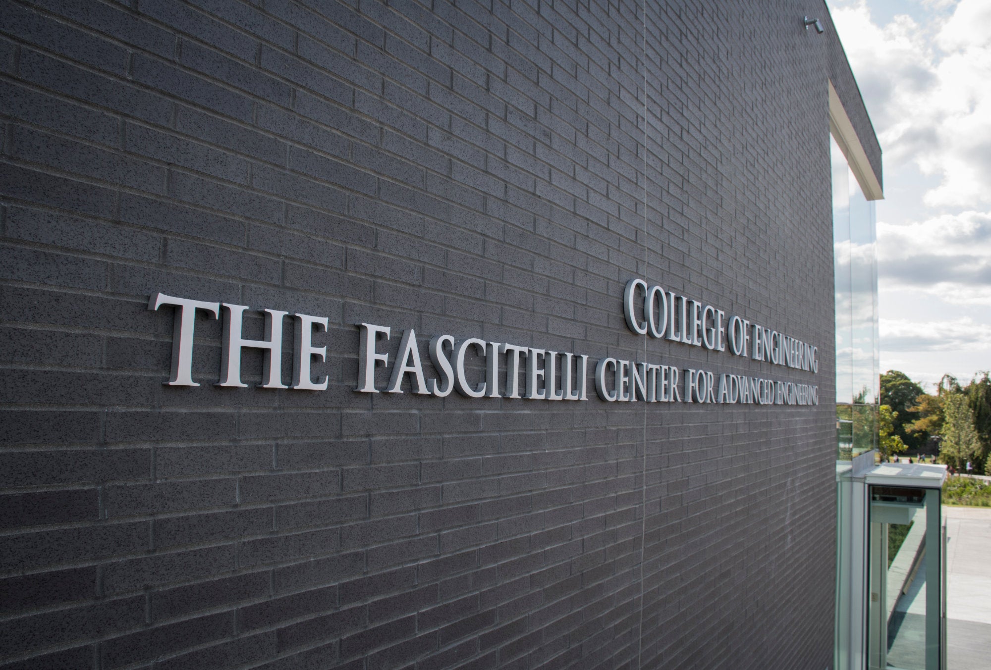 Glass exterior and sign of the Fascitelli Center for Advanced Engineering at the University of Rhode Island