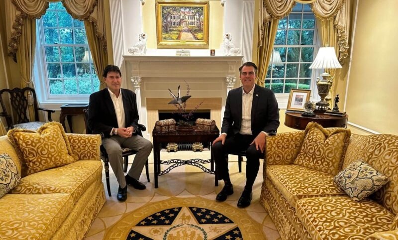 Michael Flacks and Oklahoma Governor Kevin Stitt seated at the Governor’s Mansion in Oklahoma City