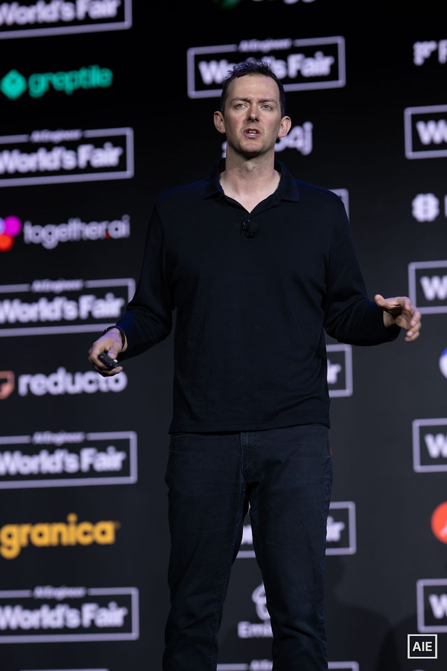 Michael Grinich speaking on stage at AI Engineer World’s Fair 2026