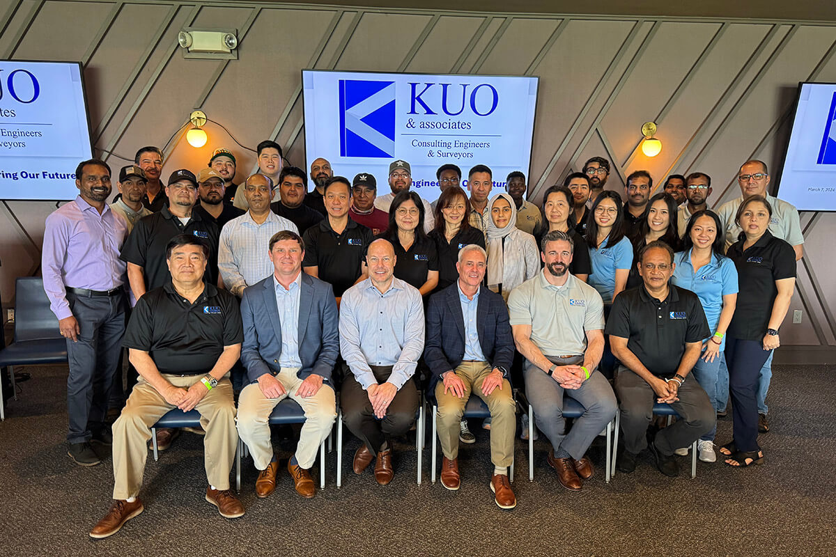Michael Hein seated with HFW colleagues and the KUO team at a partnership gathering