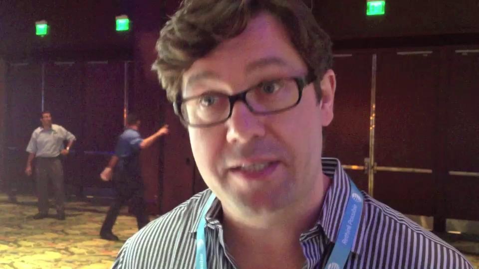 Michael Hughes wearing glasses and a striped shirt at BlackBerry World in 2012