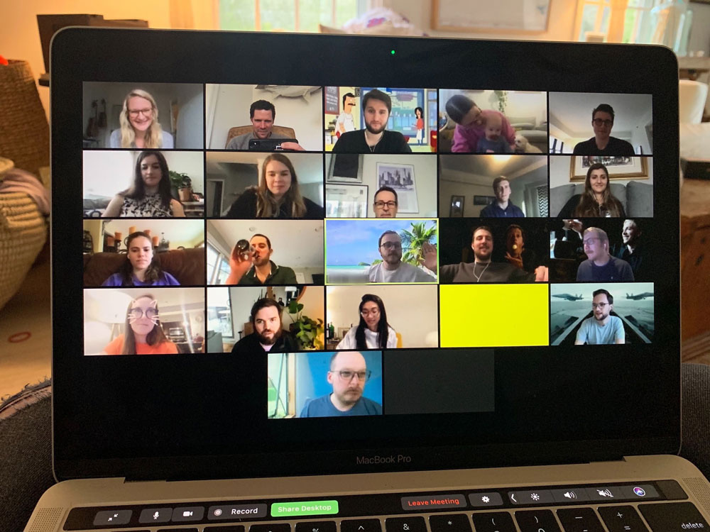 Button colleagues gathered on a laptop screen for a virtual happy hour photographed by Jaconi