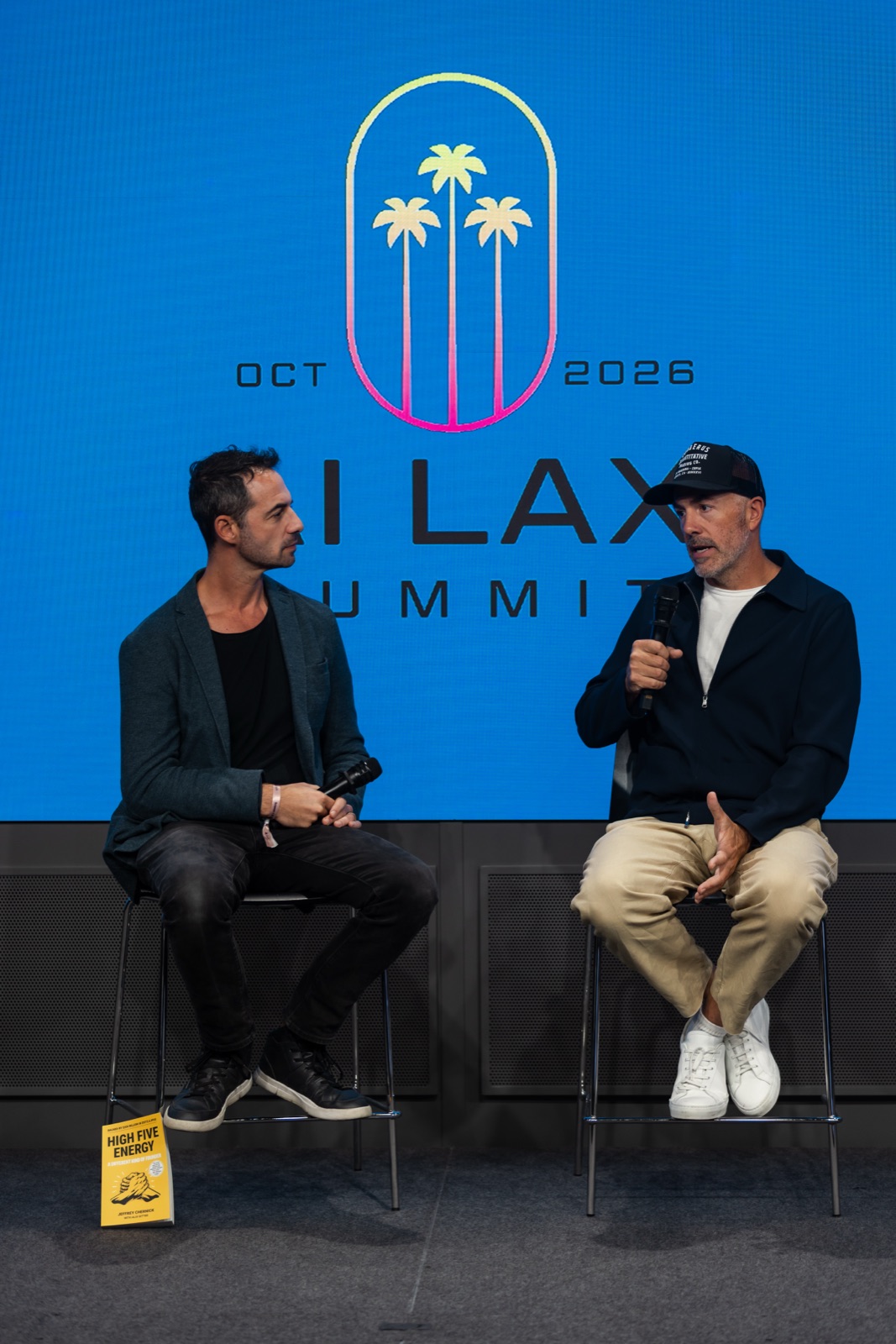 Michael Jones, at right, speaking with Jeffrey Chernick on stage at the AI LAX Summit