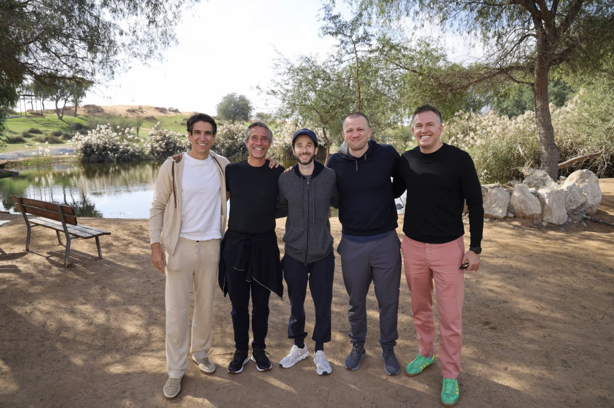 Michael Lahyani at left with fellow founders and BECO Capital leaders beside a pond at the firm’s 2026 founders’ retreat.