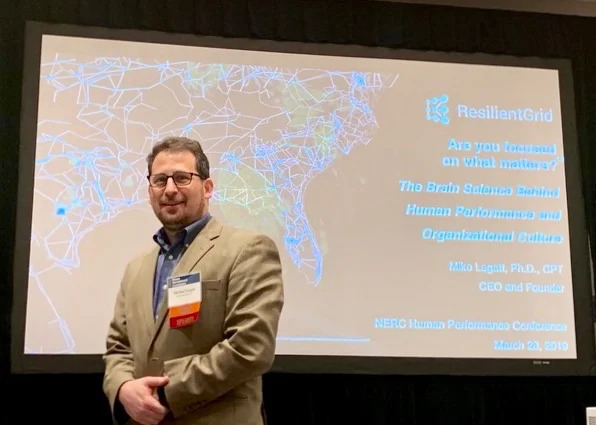 Michael Legatt standing before a ResilientGrid presentation at the 2019 NERC Human Performance Conference