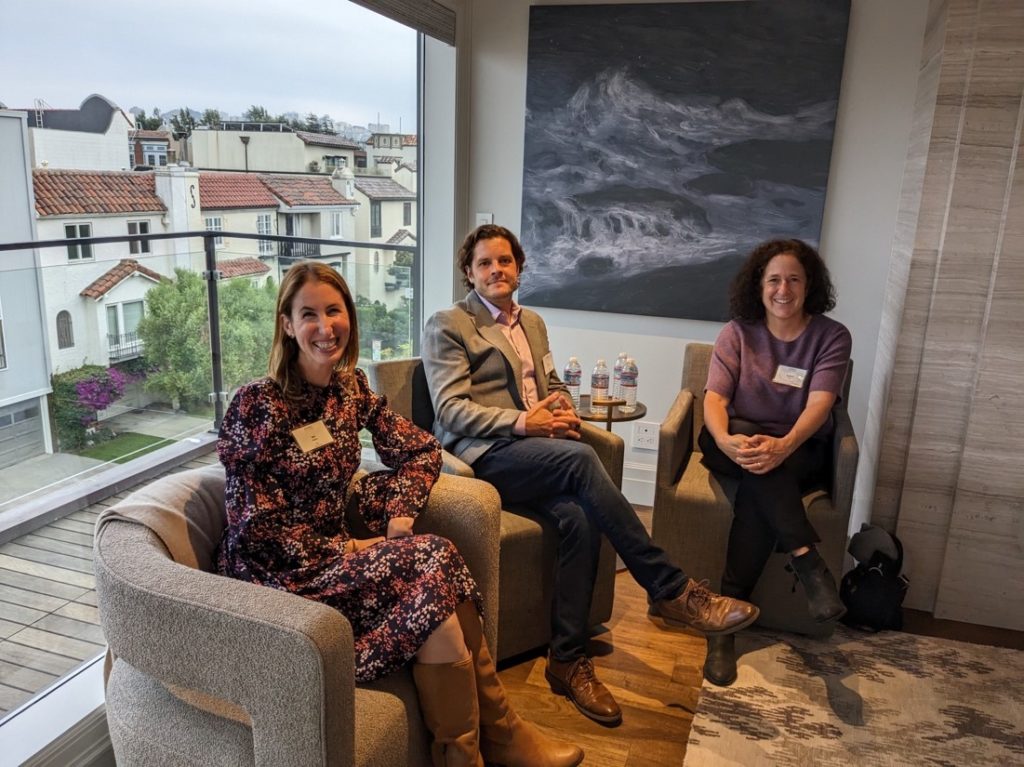 Michael Lombardo, seated between two participants at a San Francisco Education Fund discussion.
