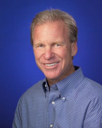 Archival portrait of Michael McCloskey in a checked shirt, published with a 2008 FrontRange interview