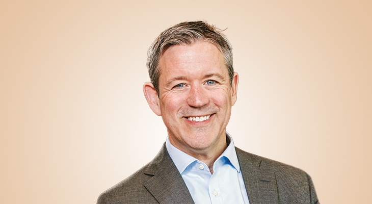 Michael Moran in a jacket and open-collar shirt, photographed for his Smart Business Dealmakers interview