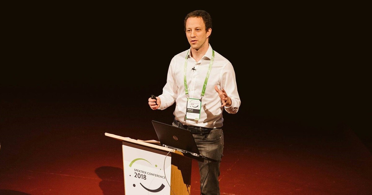 Michael Nabarro speaking at a lectern at the Spektrix Conference 2018.