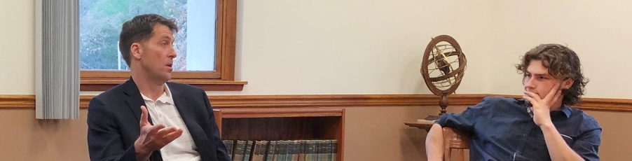 Michael Ortner, left, speaking during his visit to Thomas Aquinas College in 2019