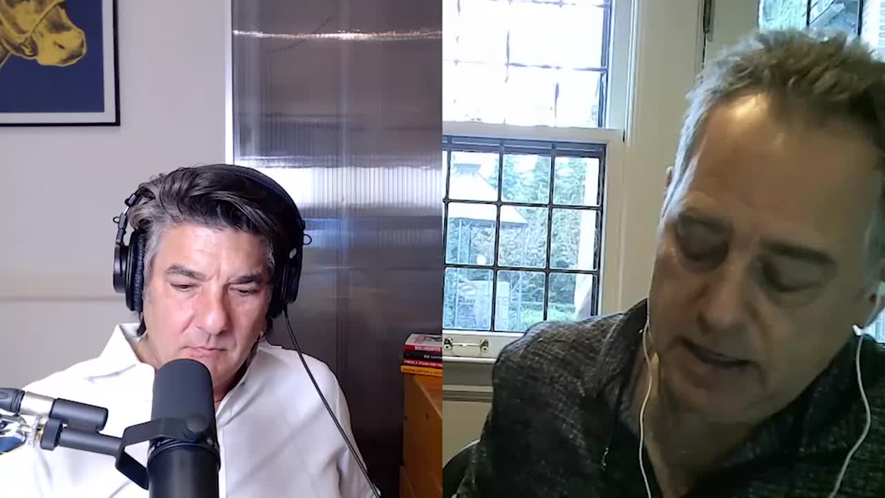 Michael Pavone wearing headphones and speaking into a microphone during a Forktales remote interview
