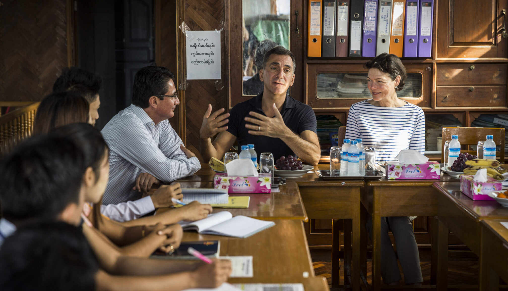 Michael Schlein and Diana Taylor in a discussion with colleagues at DAWN in Myanmar