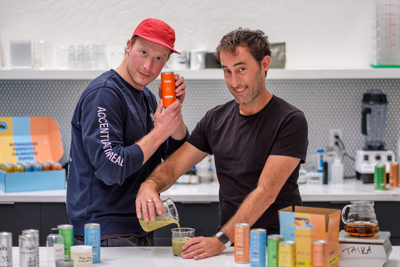 Taika co-founders Kal Freese and Michael Sharon pouring drinks in the company workspace
