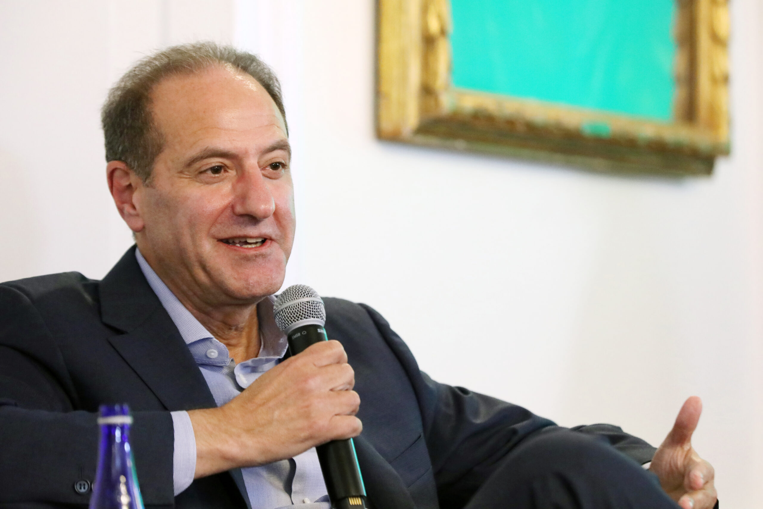 Michel Khalaf speaking into a microphone at International House in New York