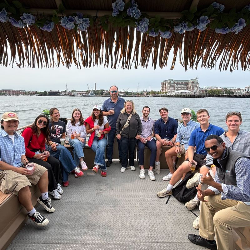 Michele Pilgrim, center, with Starburst colleagues on a Boston Harbor team outing