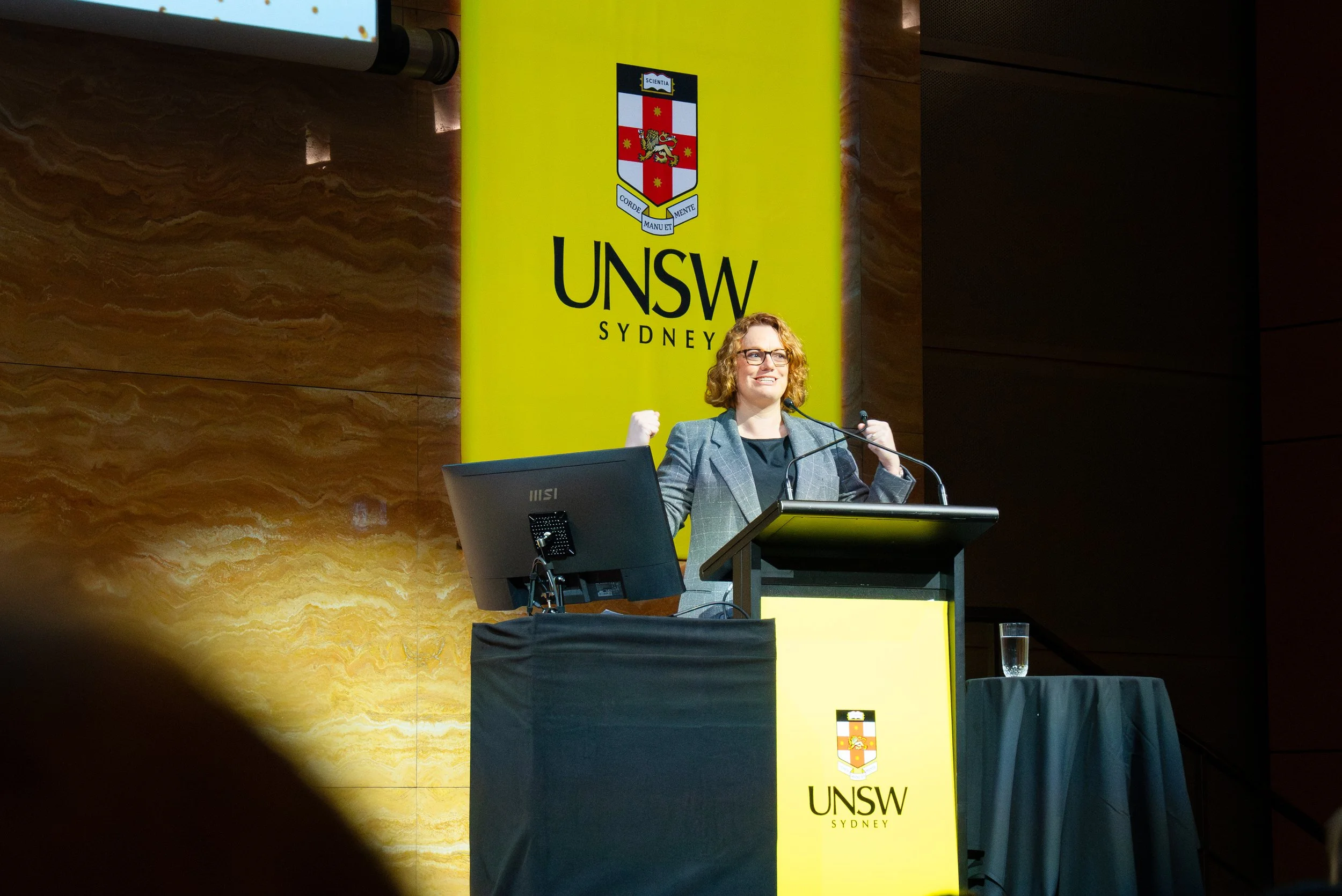 Michele Stansfield speaking at a lectern during the UNSW Female Founders Showcase