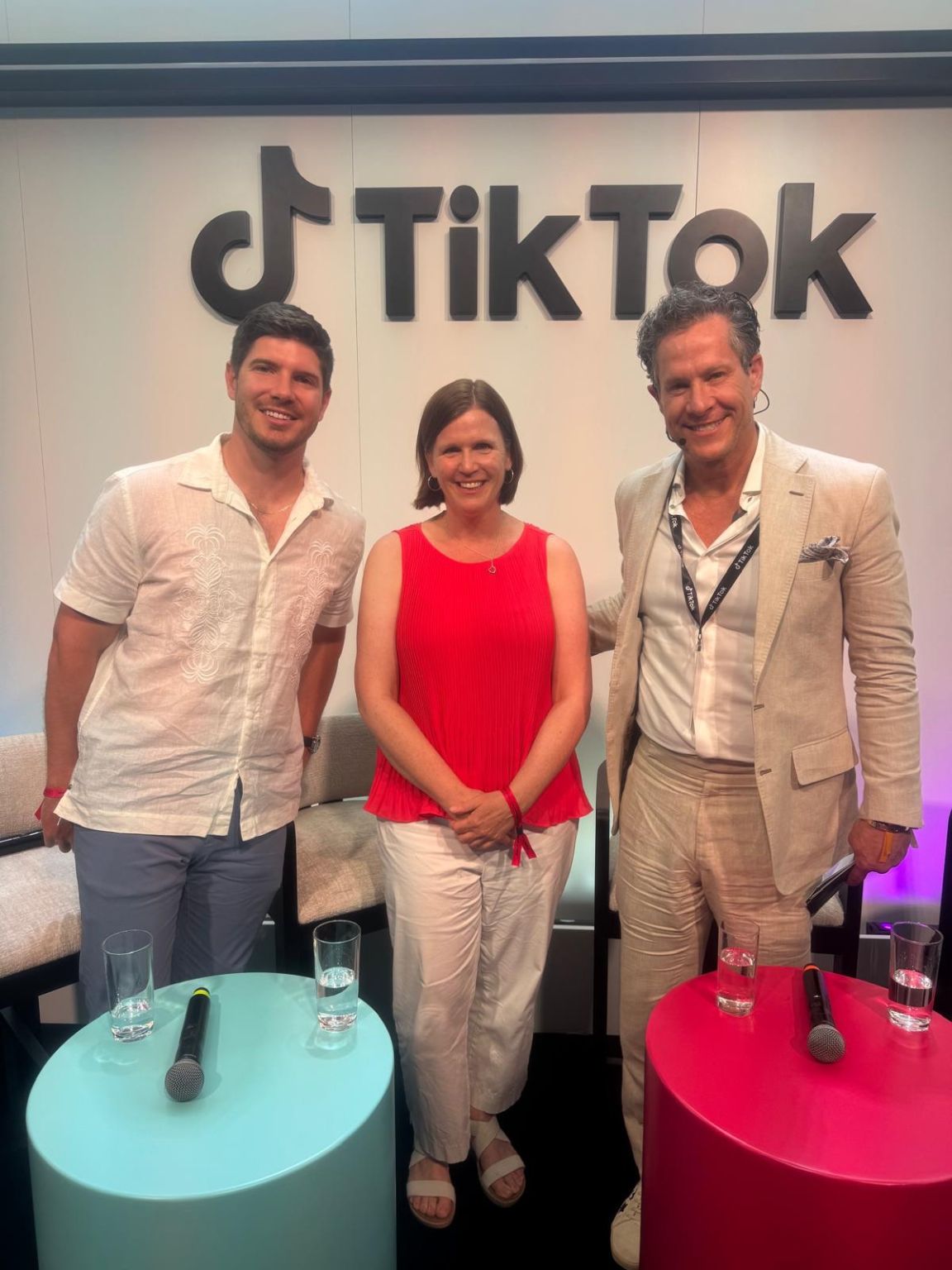 Michelle Feeney in a red top with creator Frank Michael Smith and TikTok executive Joshua Bloom after a panel discussion