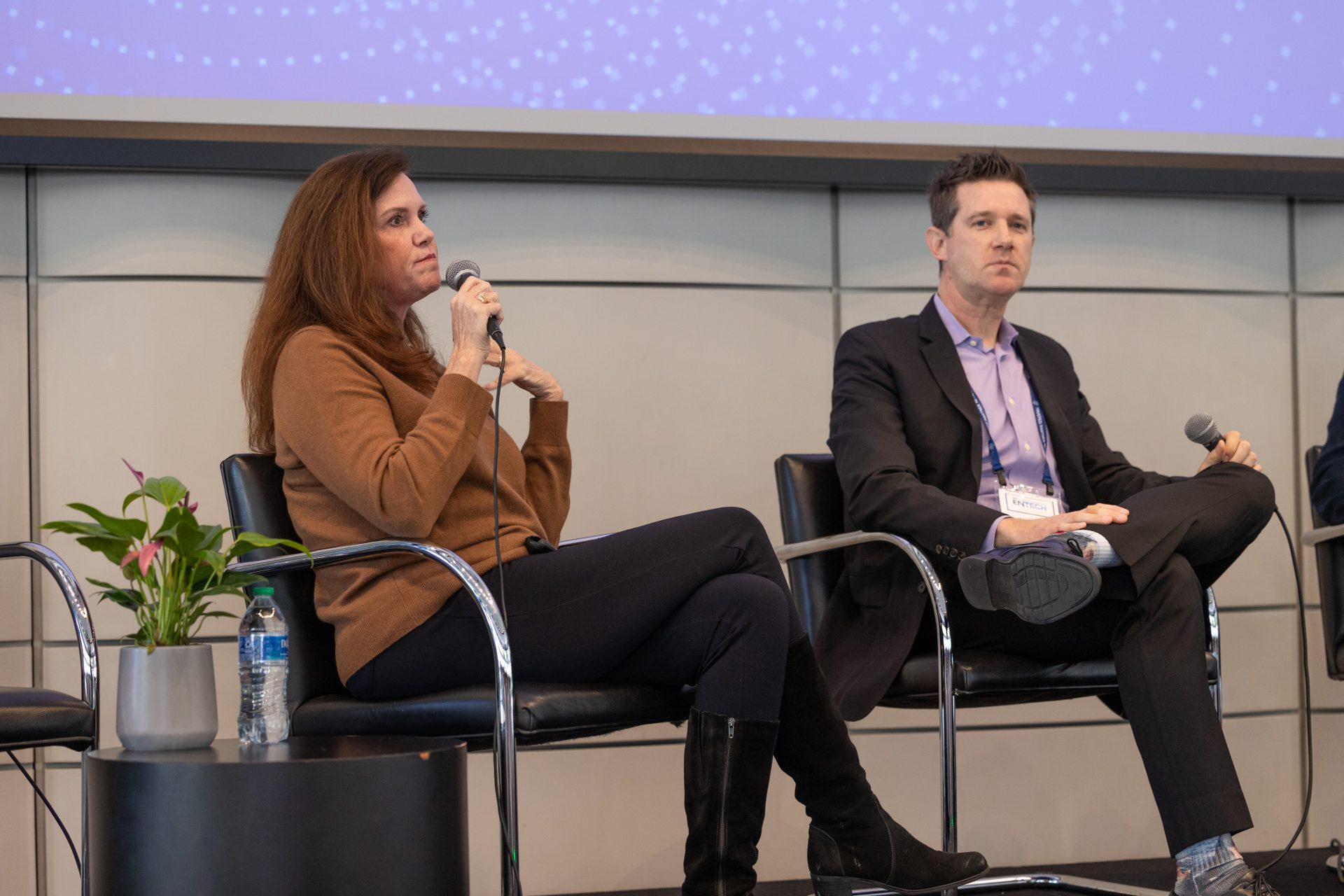 Michelle Mikesell, seated at left holding a microphone, speaking at DEG EnTech Fest in February 2024