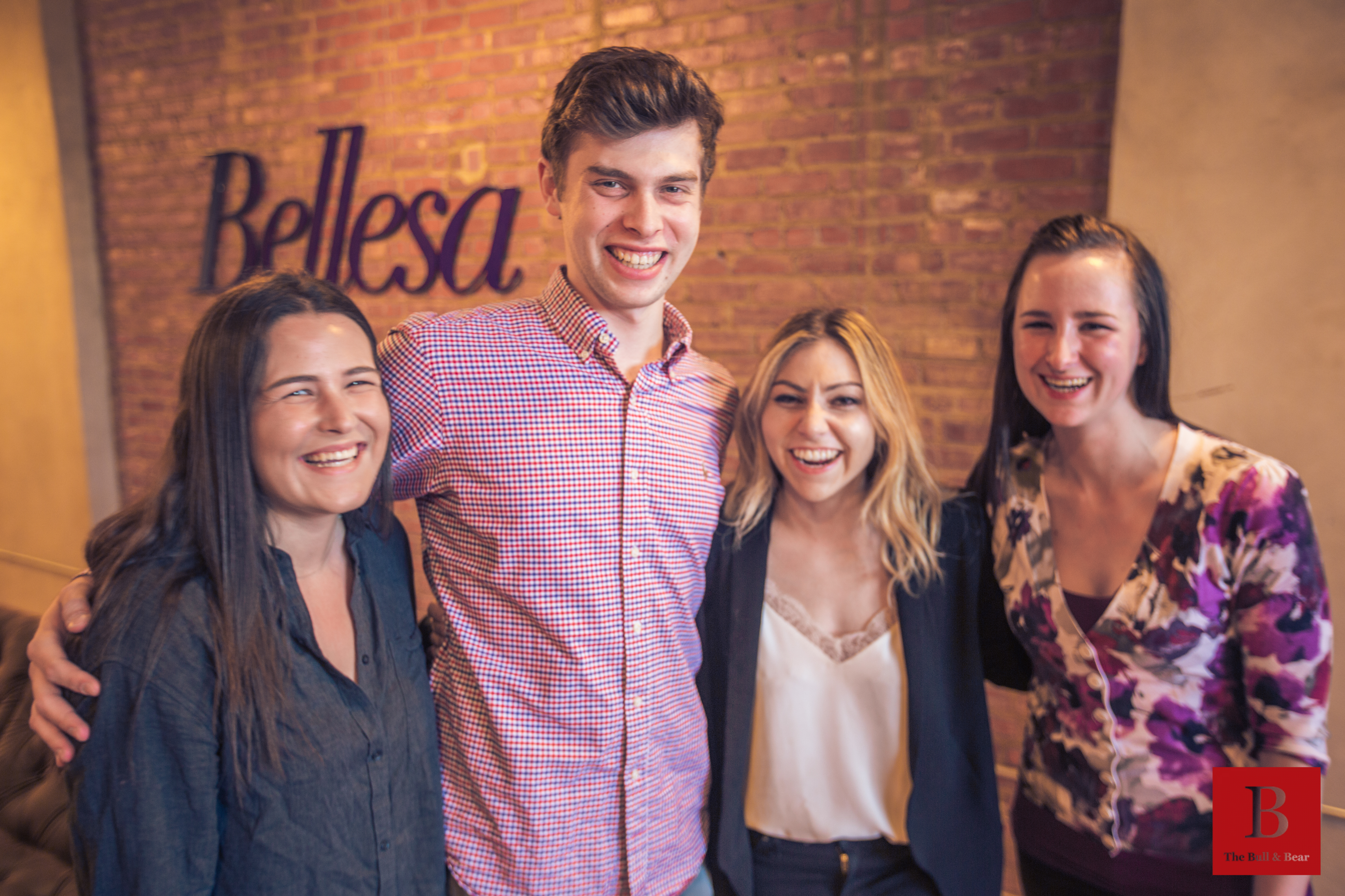 Molly Harris, Ben Butz-Weidner, Michelle Shnaidman and Jess McLaren laughing together at Bellesa’s office in 2017