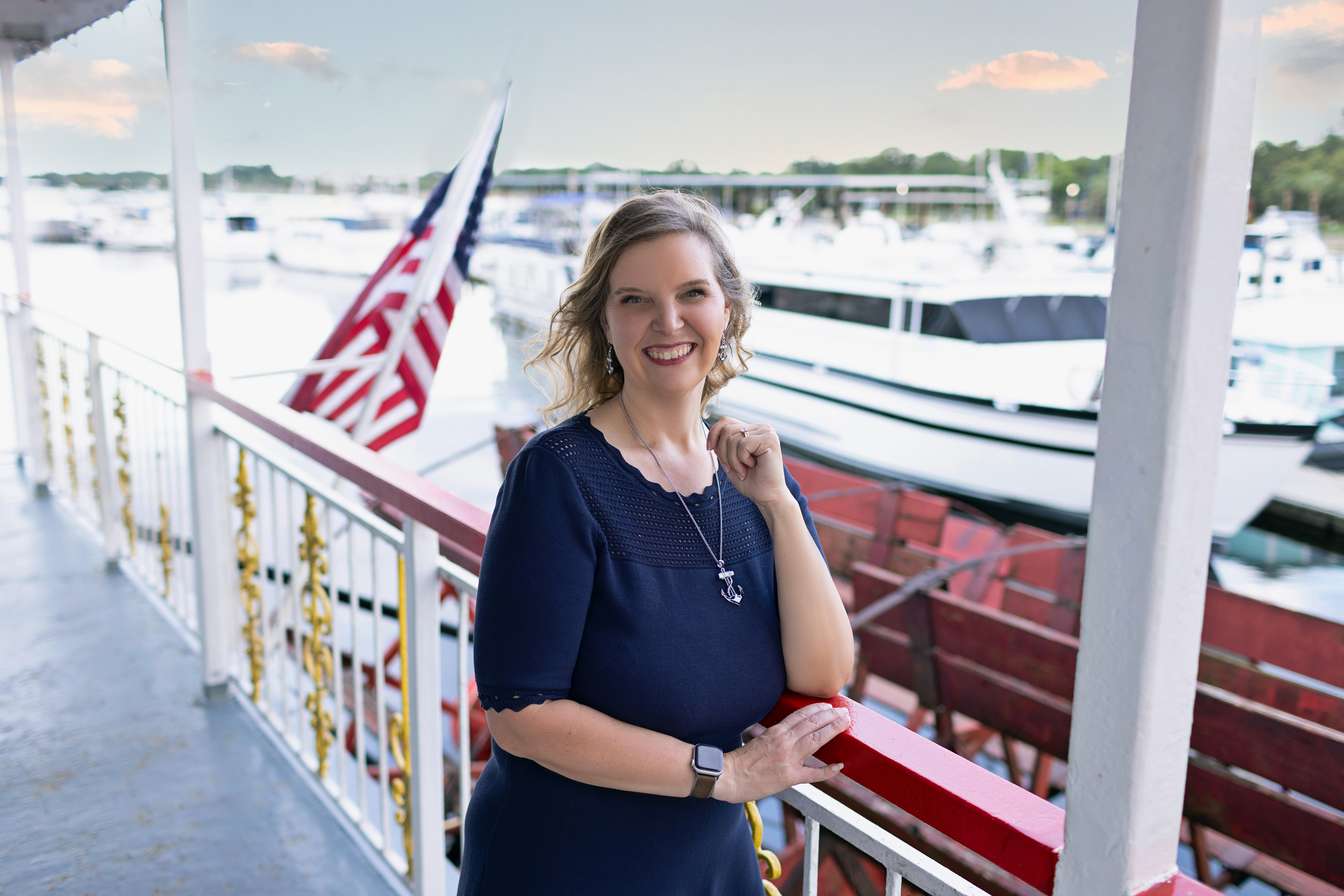 Michelle Wyatt aboard the Barbara Lee, beside the red railings and paddlewheel