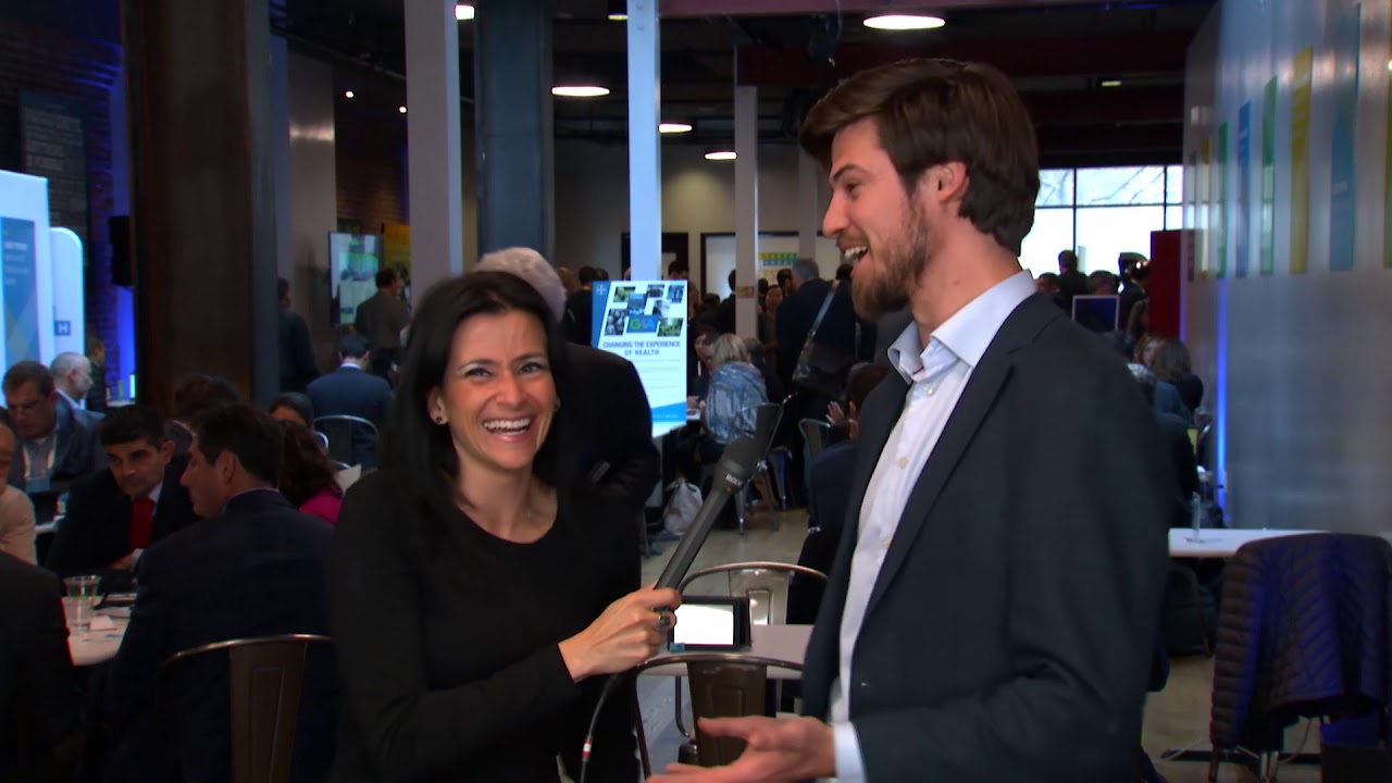 Jessica DaMassa interviews Michiel Rauws in a busy San Francisco conference venue