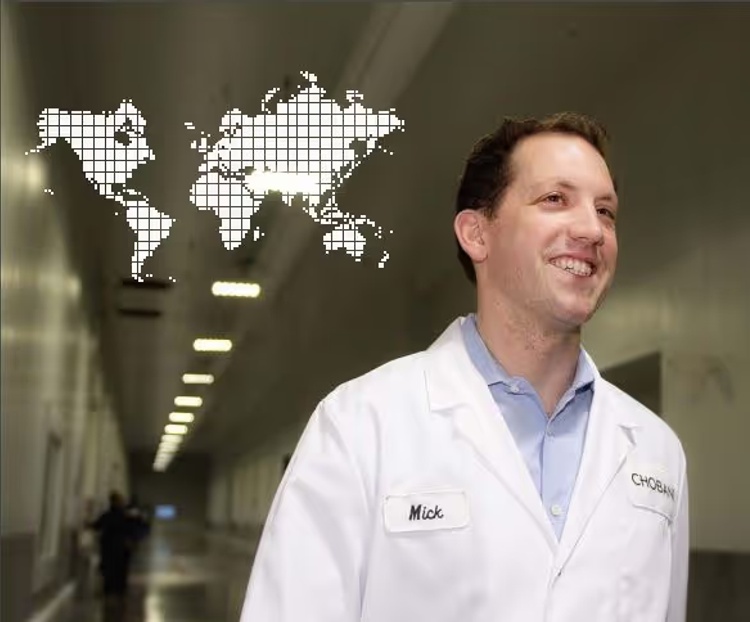 Mick Beekhuizen in a Chobani coat in a production facility corridor