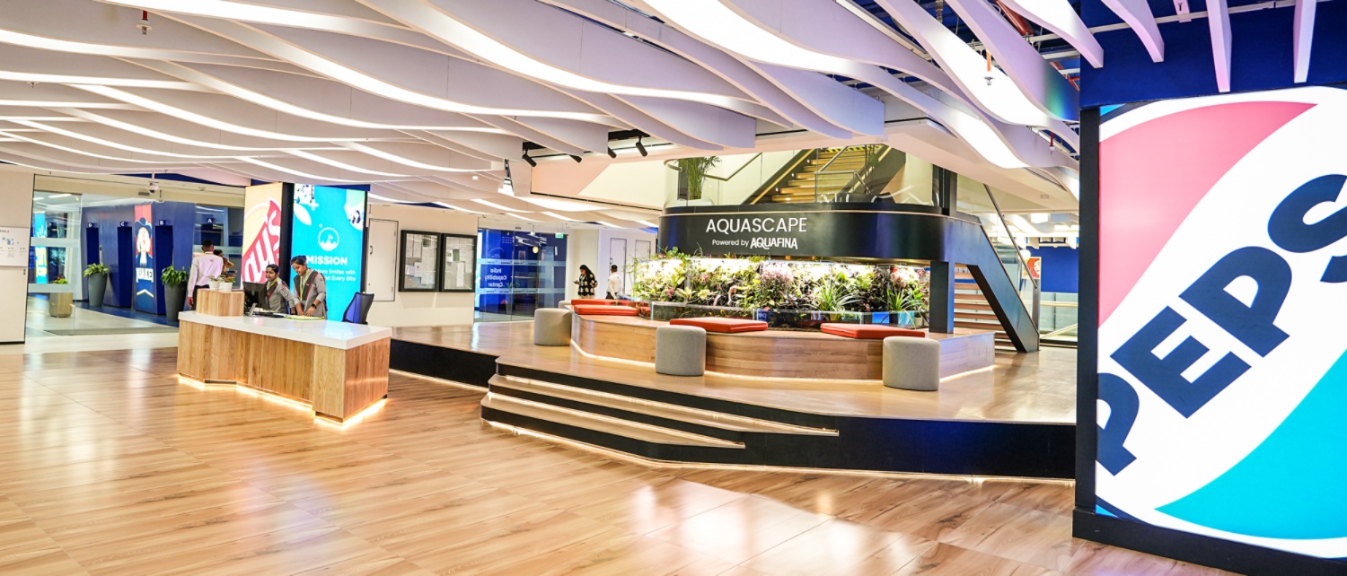 PepsiCo office interior with reception desk, seating, and Pepsi branding