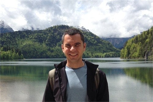 Mihai Parparita smiling beside an alpine lake