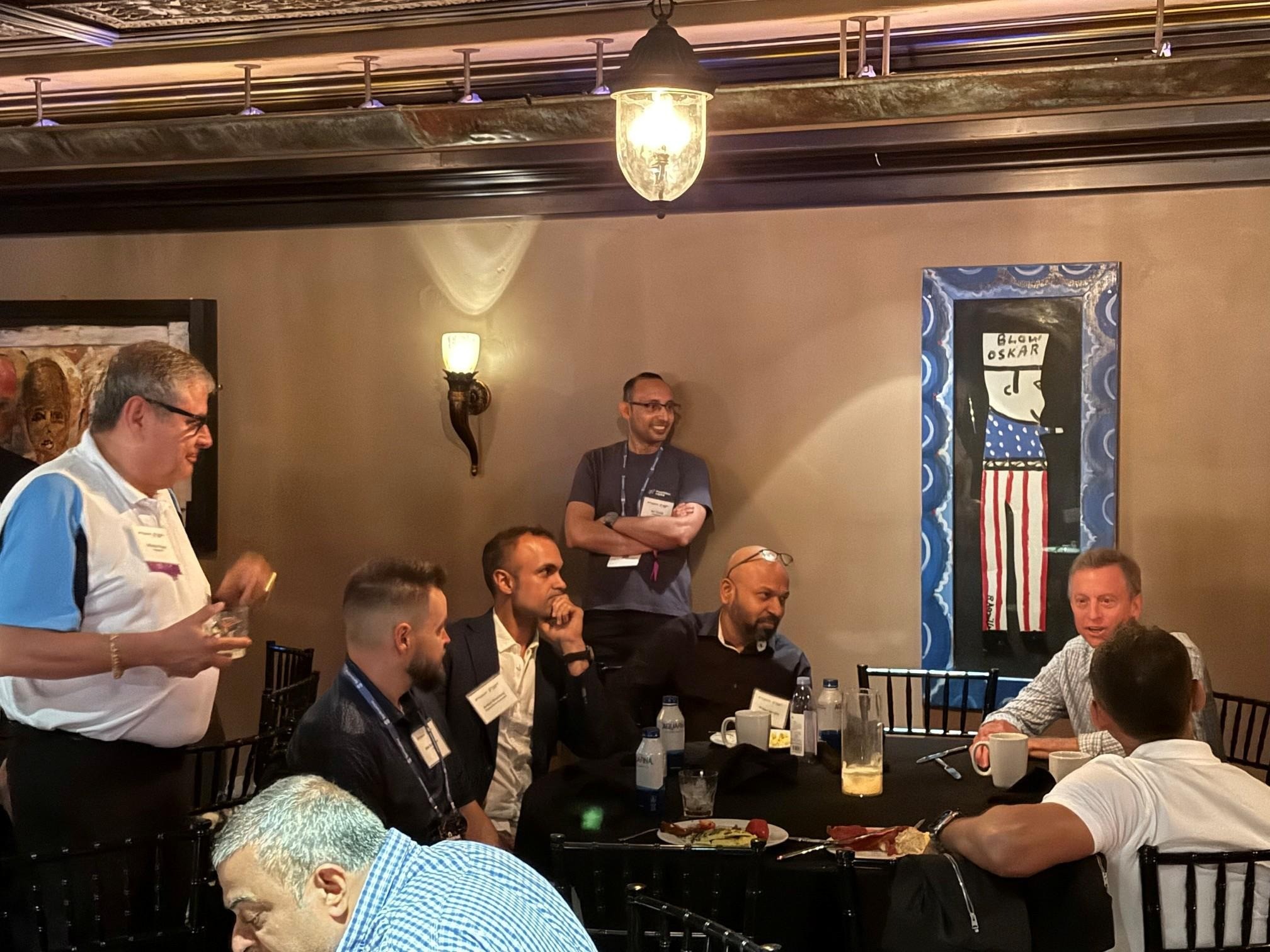 Mike Armistead, seated at right, discussing Pulse with security leaders around a brunch table