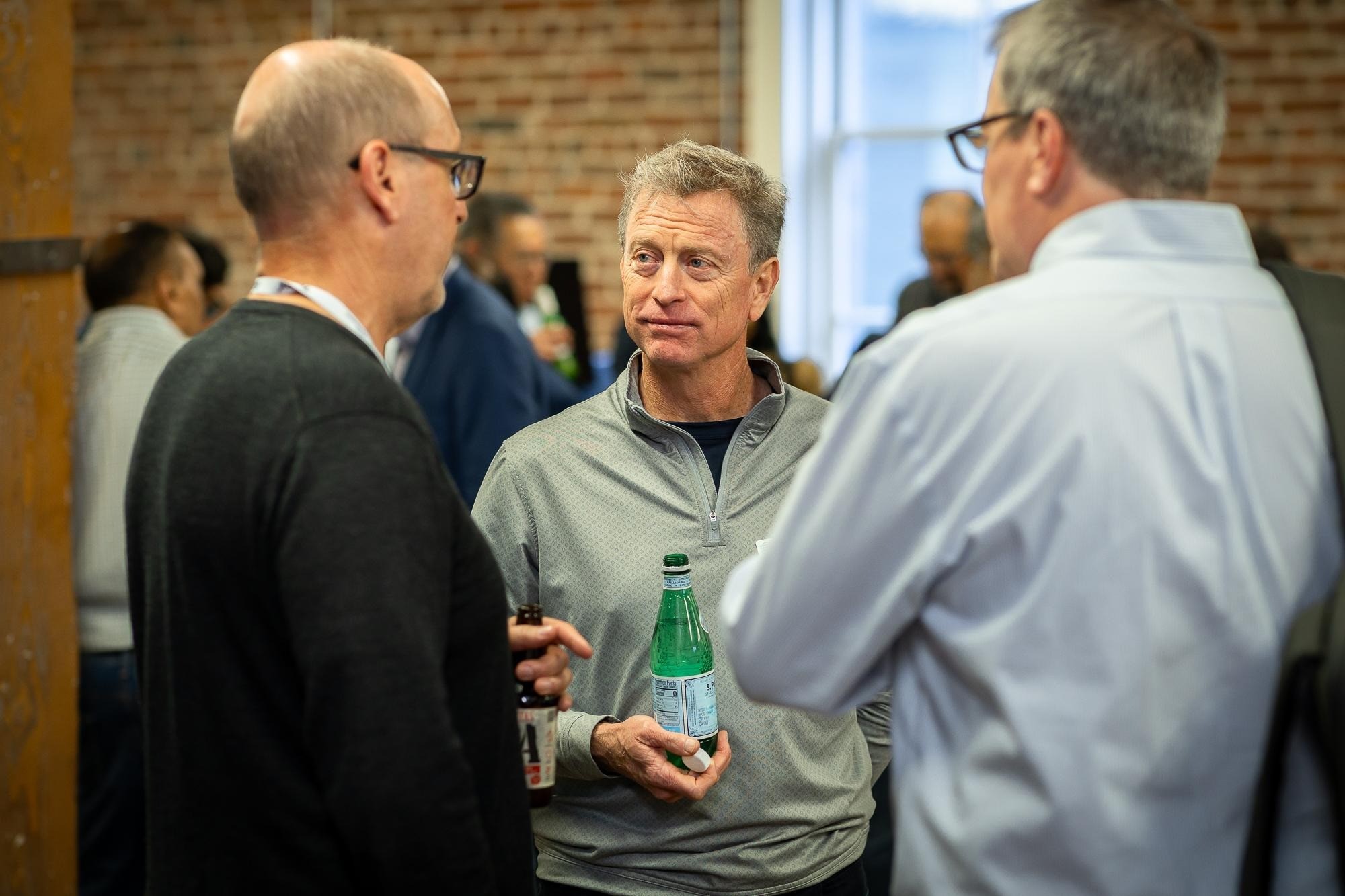 Mike Armistead, center, talking with Robert Hipps and Hans Gustavson at an industry gathering