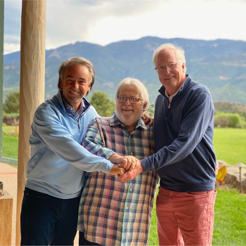 Mike Cornell at left with two companions outdoors