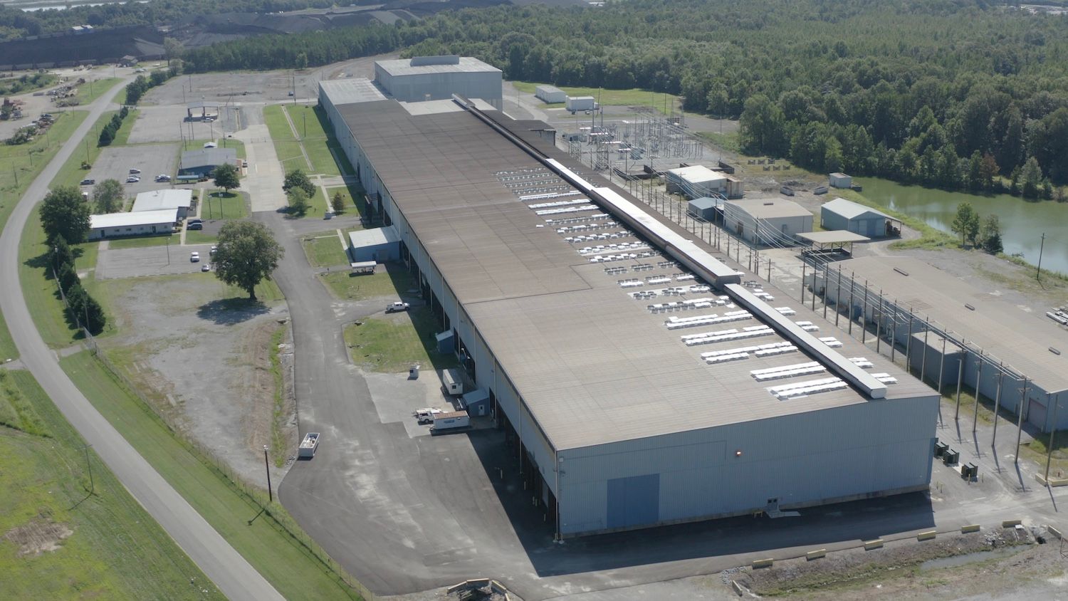 Aerial view of an industrial Core Scientific data-center facility and electrical infrastructure