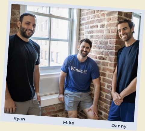 Windmill founders Ryan Figlia, Mike Mayer and Danny Mayer together beside a window