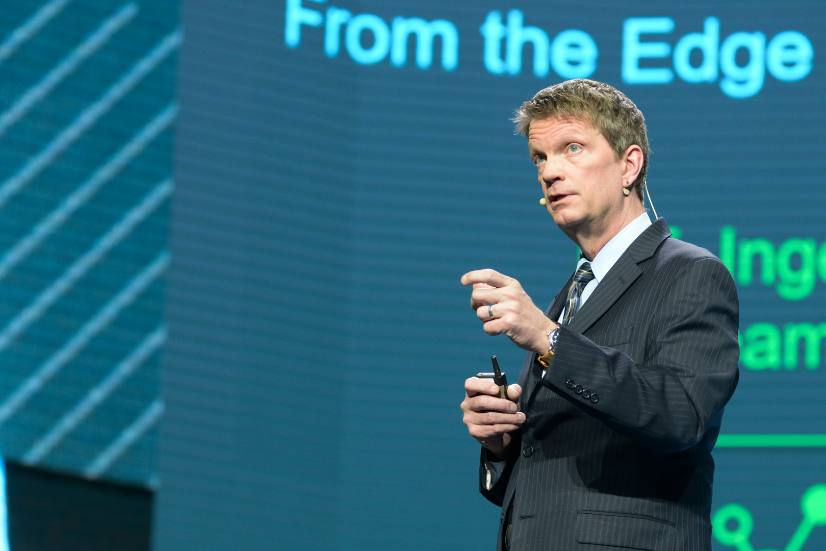 Mike Olson speaking on stage at the 2019 Baker Hughes annual meeting