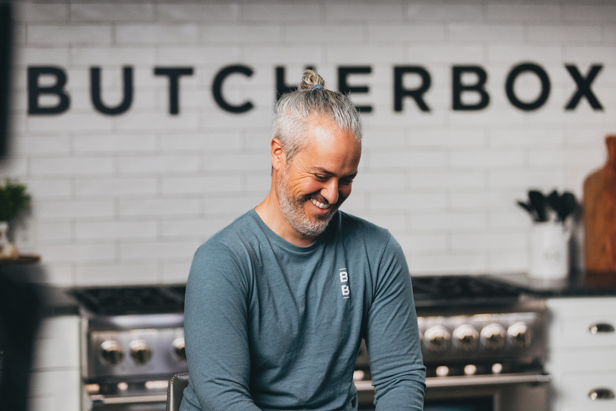Mike Salguero smiling in the ButcherBox kitchen