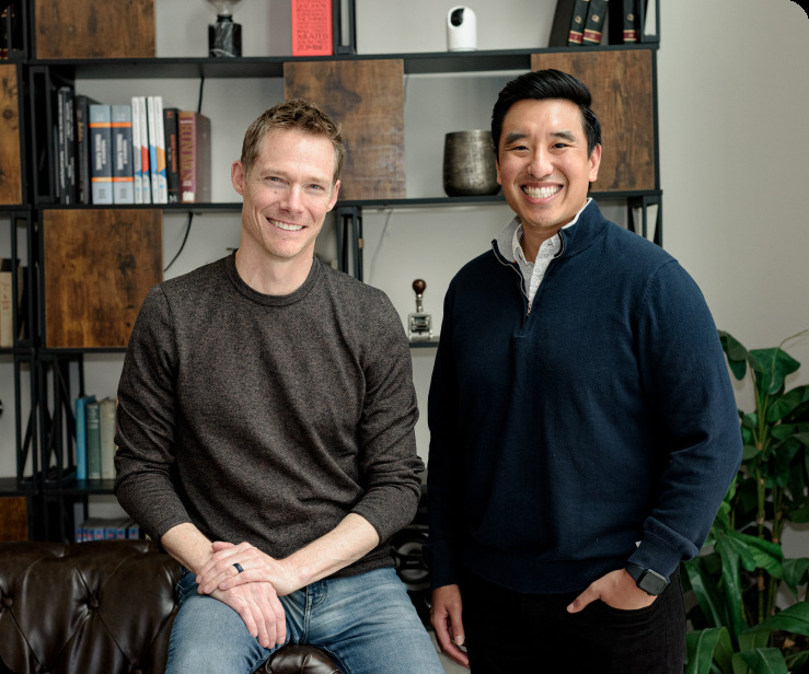Mike Schrobo seated beside Fraud Blocker co-founder Brandon Tome in their office