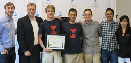 Mike Swift standing with Illini Hackers and university staff at a 2015 award presentation