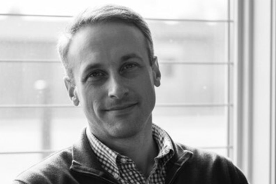 Black and white portrait of Adam Gramegna from Military.com's editorial page