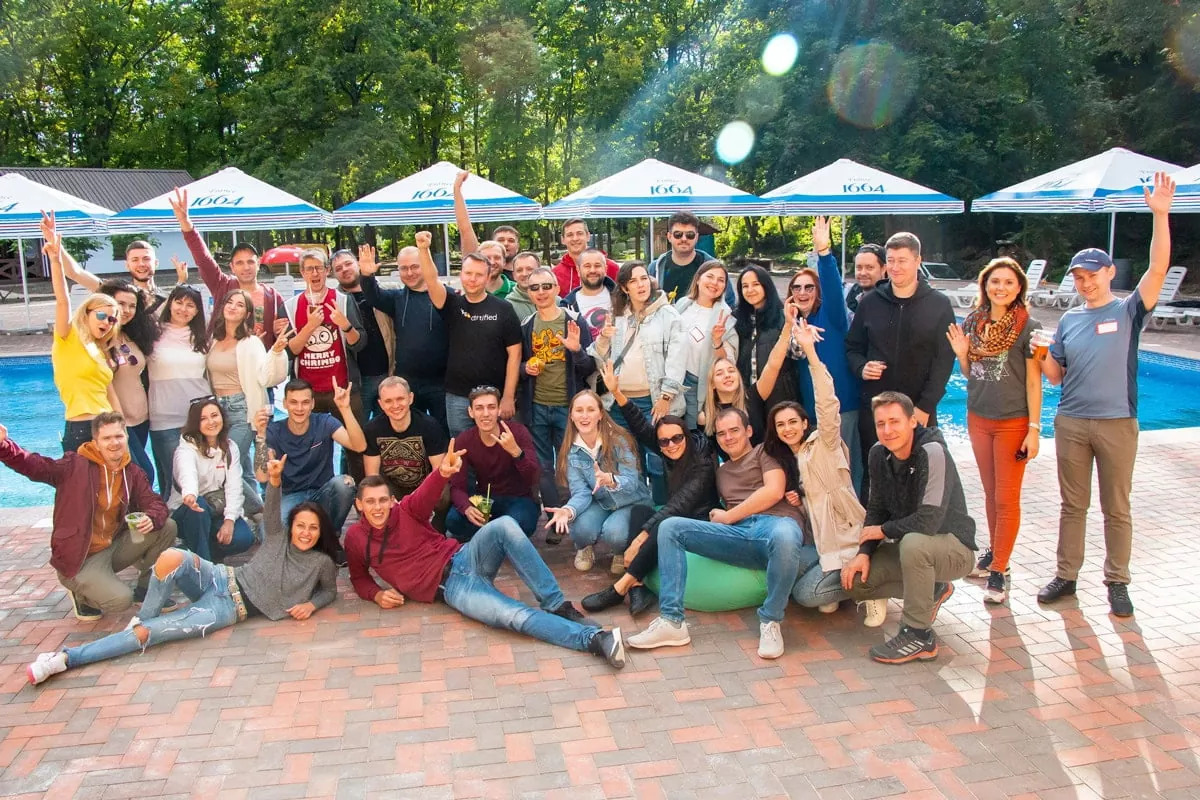 Members of the MindK team gathered outdoors