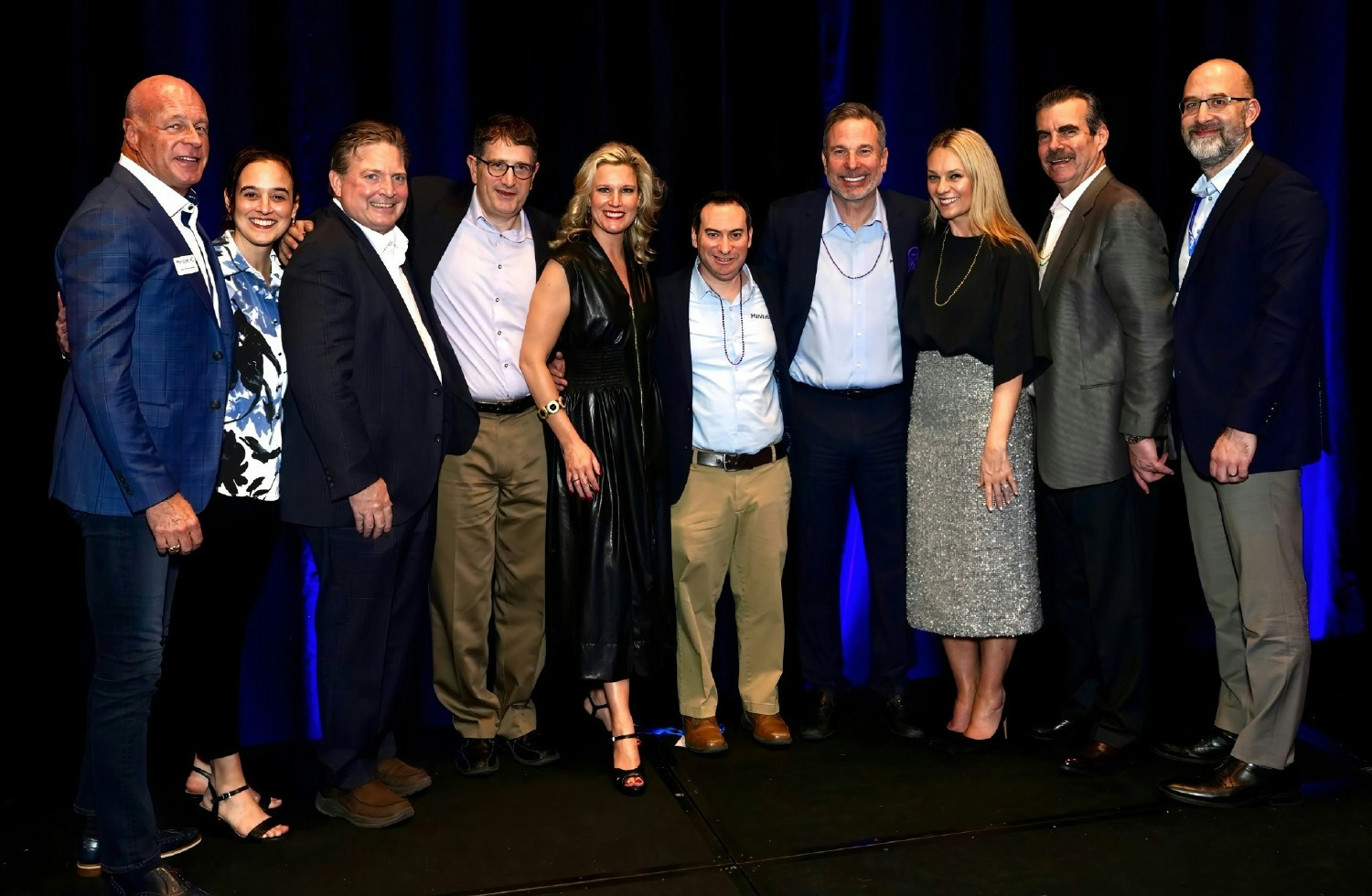Minitab executive leadership posing together at an annual sales kickoff