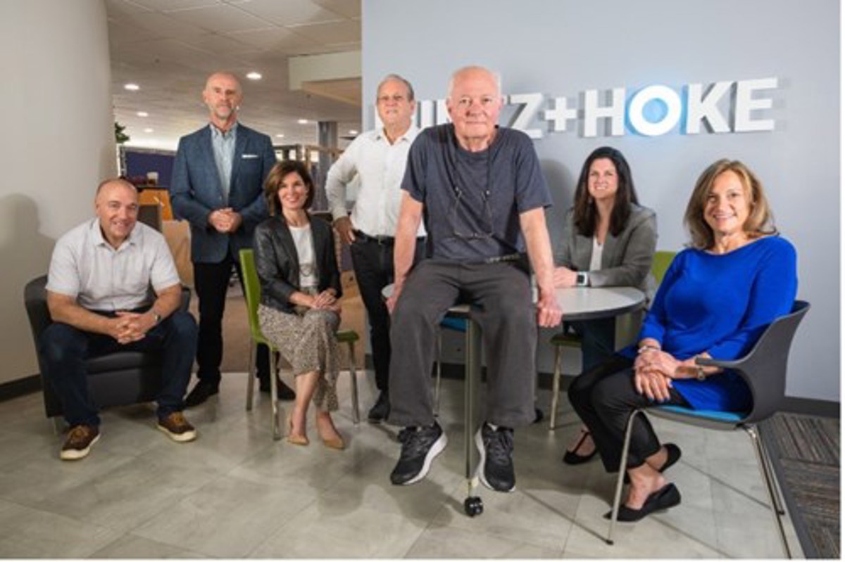 Mintz + Hoke principals with retired co-founder Joe Hoke in the Avon office