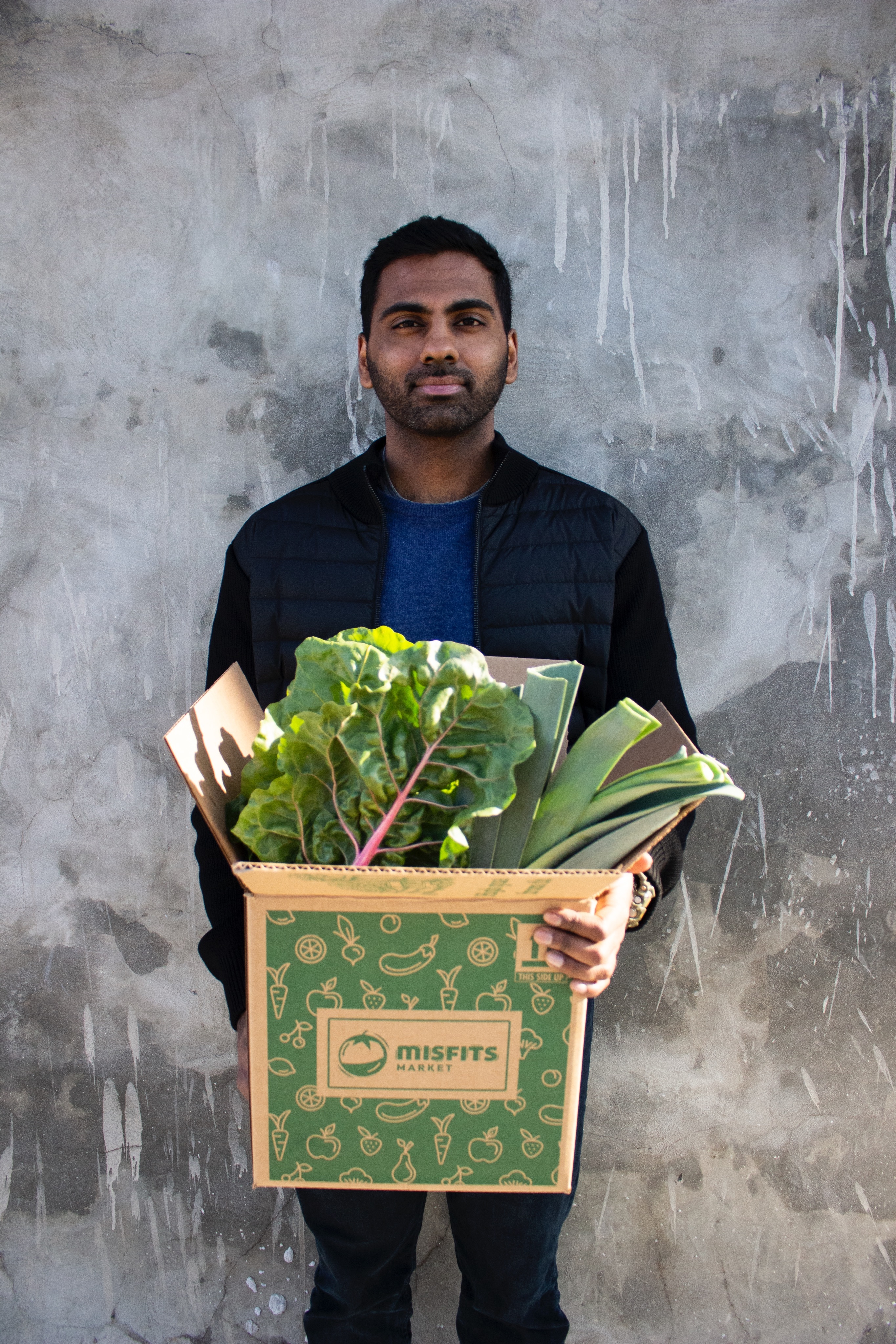 Abhi Ramesh holding a Misfits Market produce box