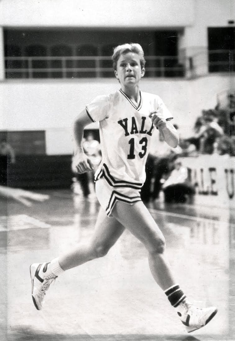 Missy Park running on the basketball court in a Yale number 13 uniform