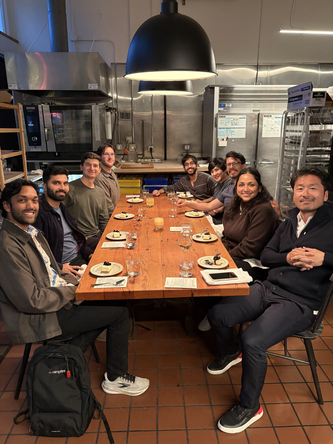 Mitch Radhuber and a small group of fintech engineers, leaders and founders seated around a dinner table in a San Francisco kitchen