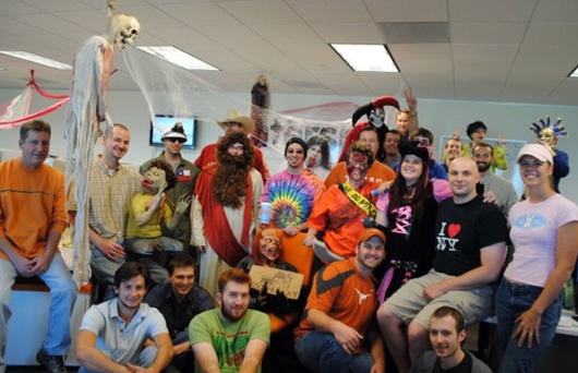 An early BigCommerce office team gathered in Halloween costumes